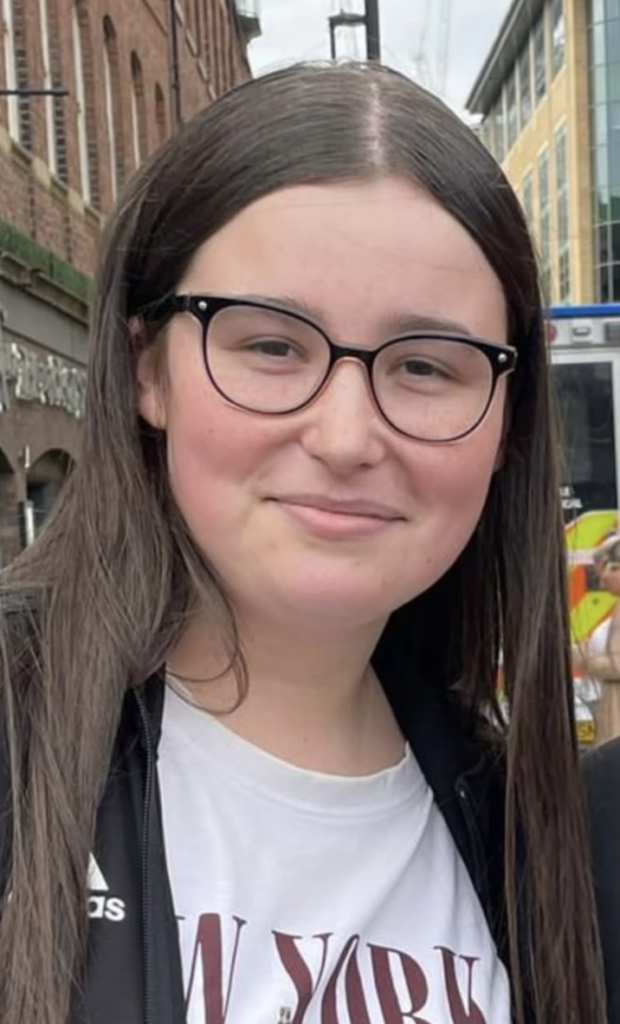 PC Jess Turnbull has died in the line of duty. Here she wears a white tee-shirt and black rimmed glasses